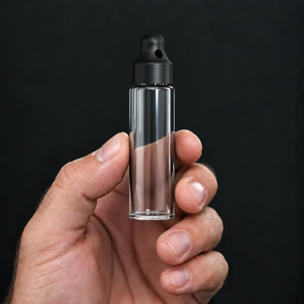 Hand holding a 24 ml slim, clear bottle with a SN*F Small sniffer cap